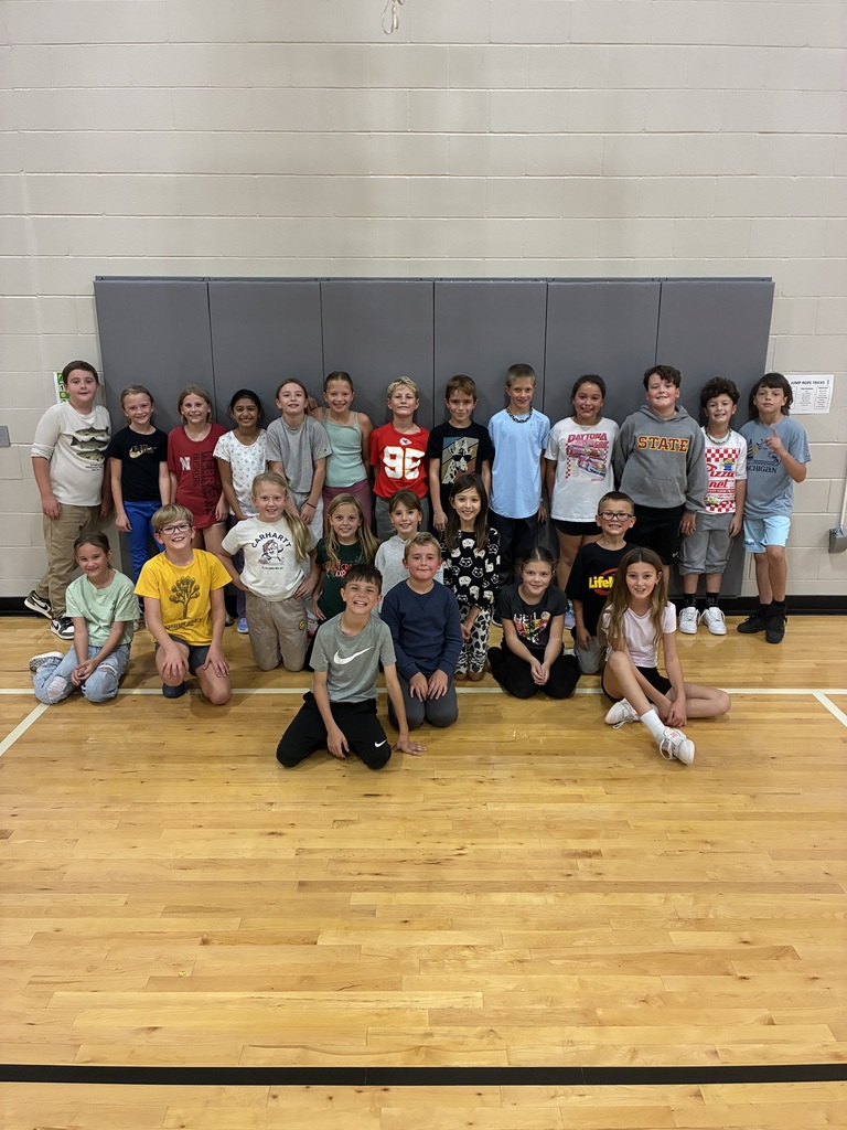 Students in Mrs. Love's Class at Harvest Hills pose for a photo in PE