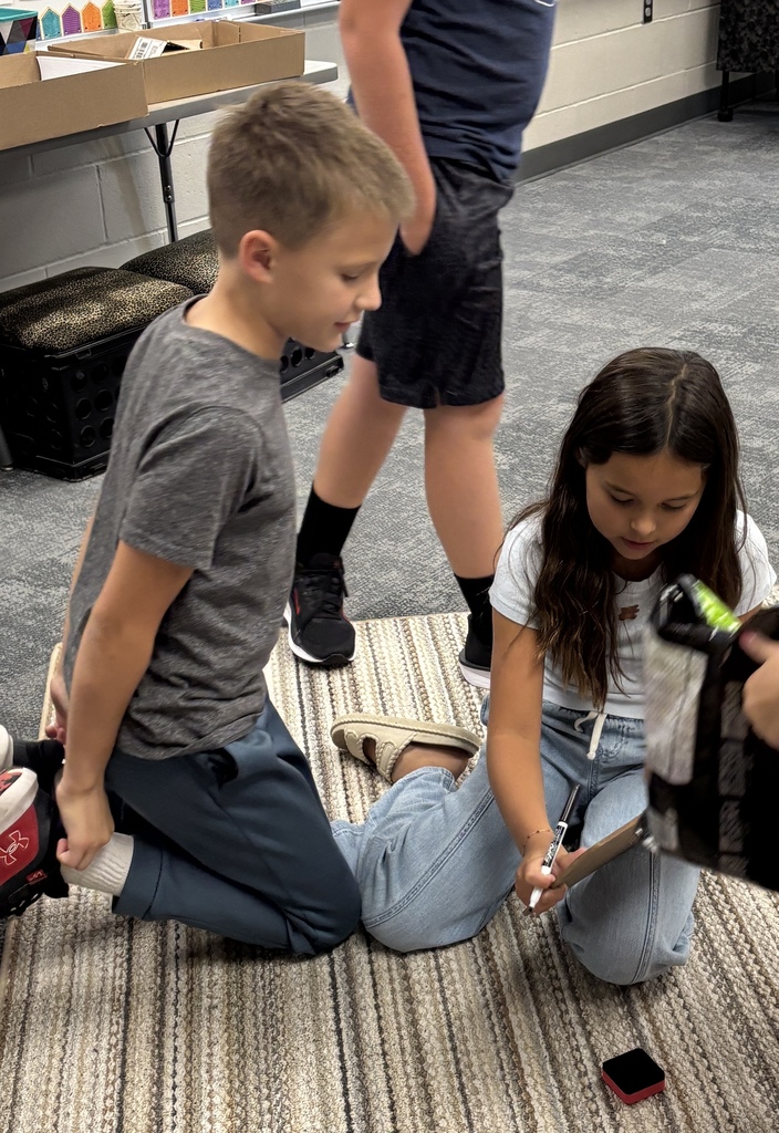 Students in the Harvest Hills HAL program work together to solve math problems with candy.