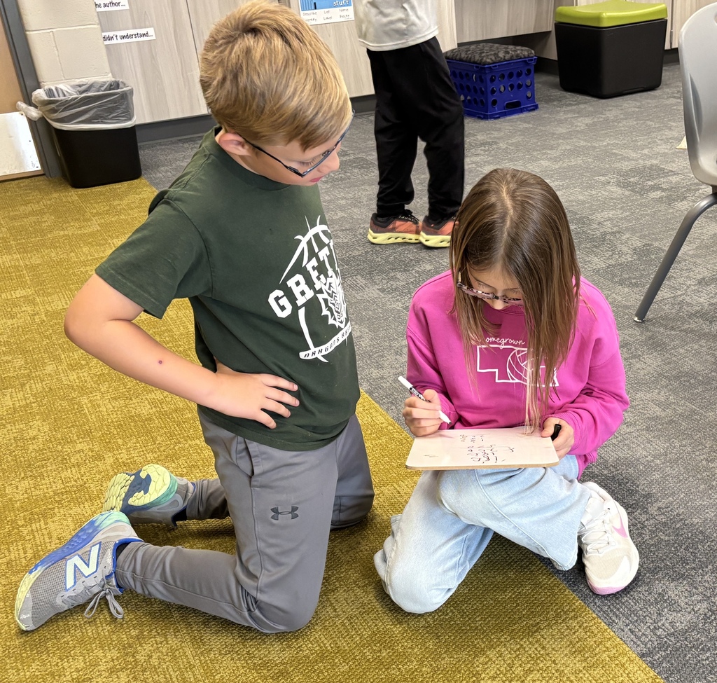 Students in the Harvest Hills HAL program work together to solve equations.