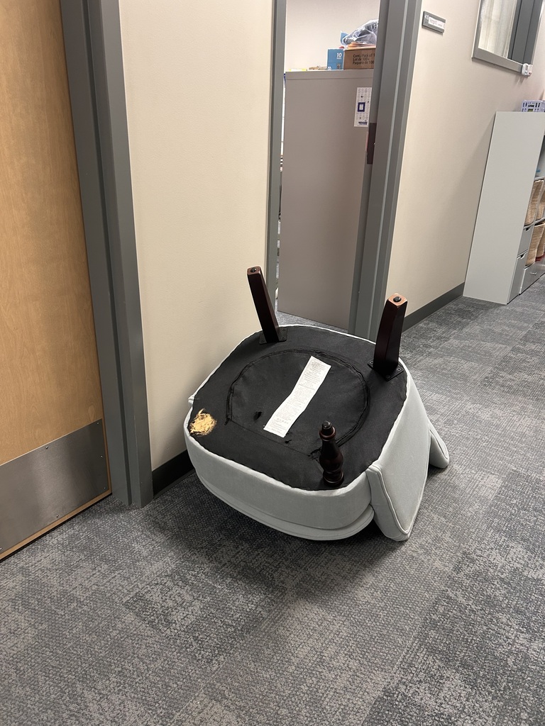 A chair from the office being worked on.