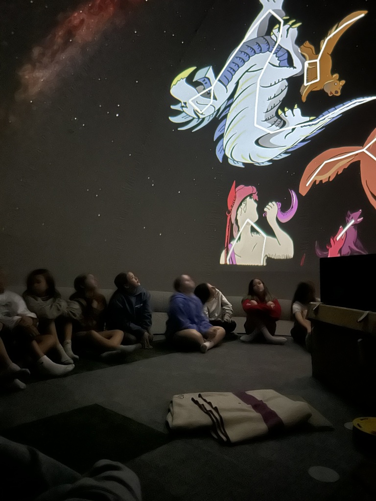 Students seated inside the planetarium in the Harvest Hills Media Center.