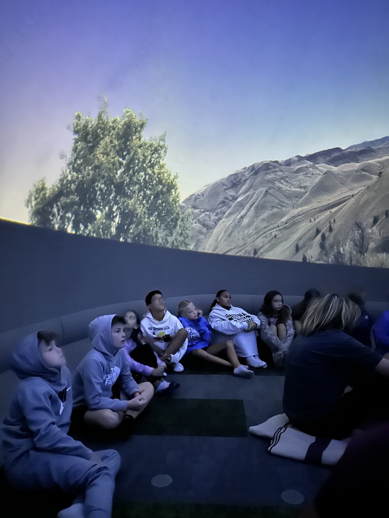 Students seated inside the planetarium in the Harvest Hills Media Center.