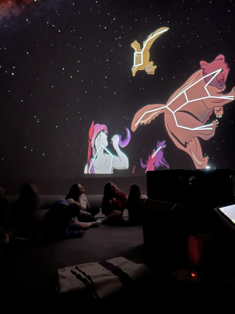Students seated inside the planetarium in the Harvest Hills Media Center.