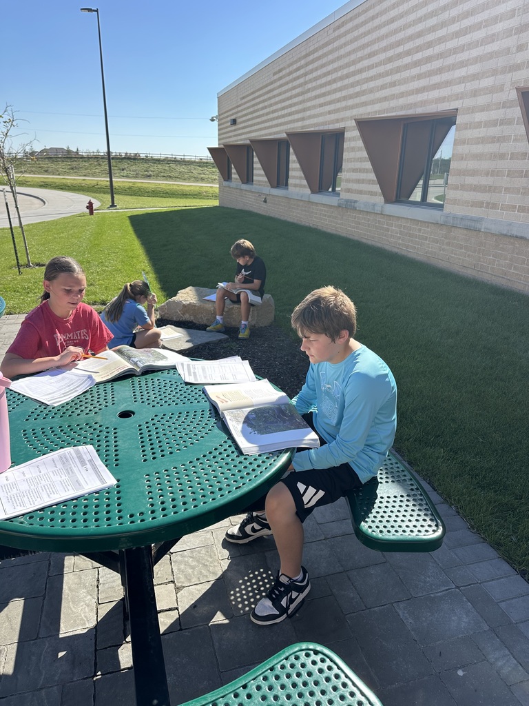 Harvest Hills students learning in the outdoor classroom.