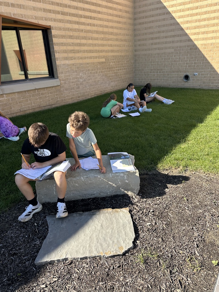 Harvest Hills students learning in the outdoor classroom.