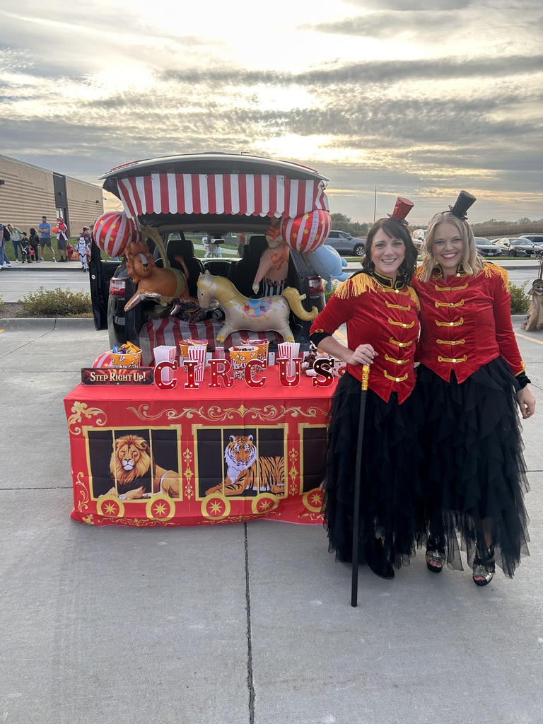 Teachers pose by their decorated trunk for an event at the school.