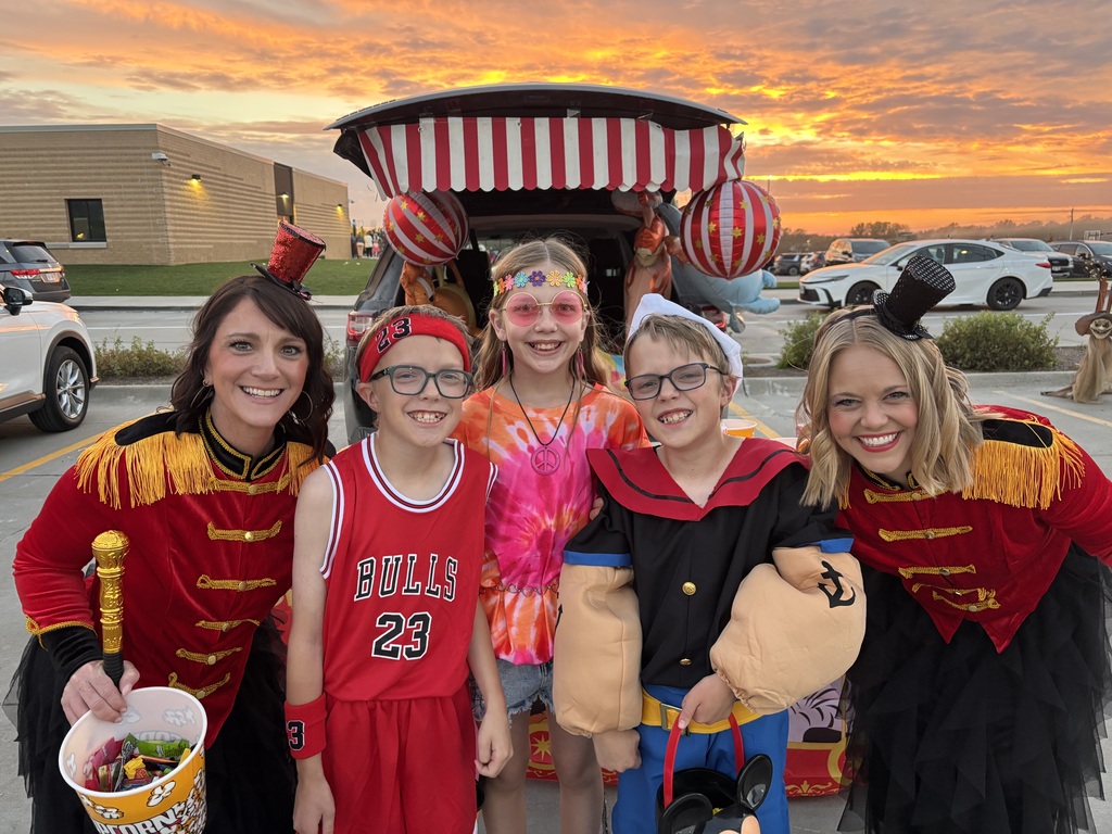 Students and teachers pose for a photo at the Harvest Hills Elementary School Trunk or Treat.