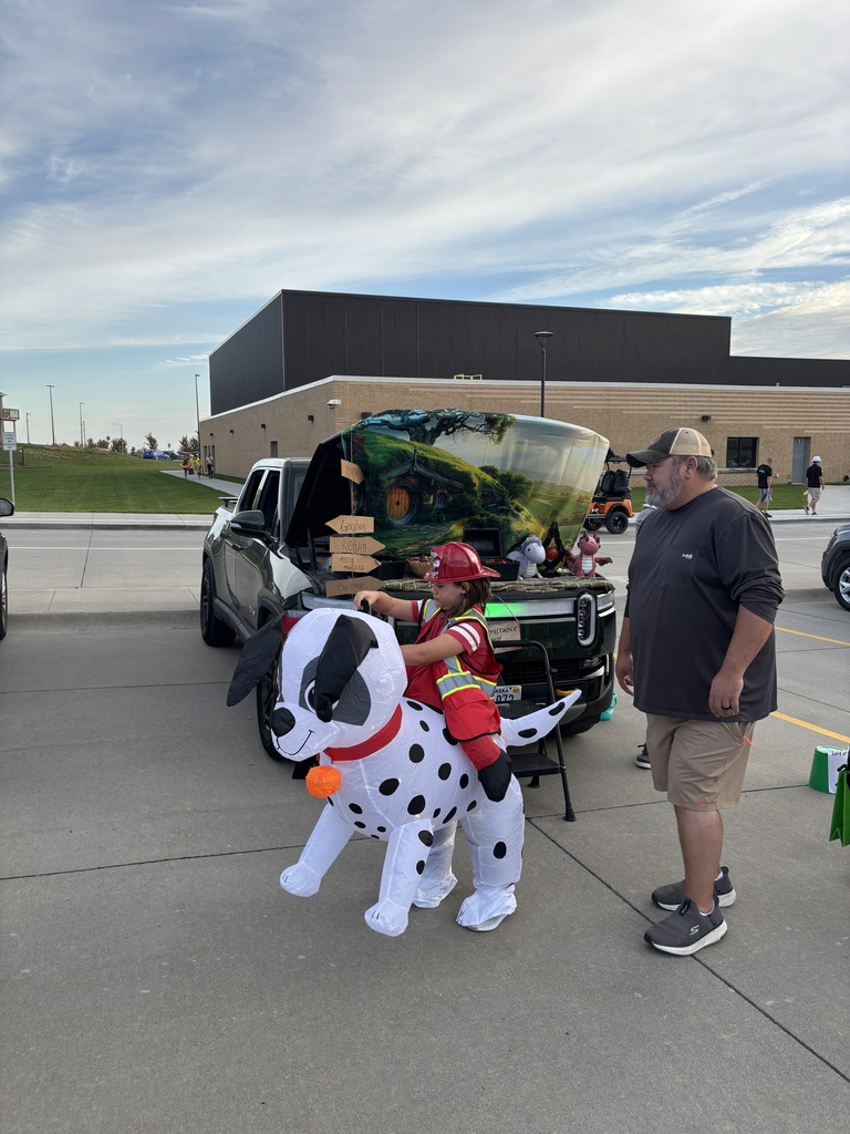 Student and parent at trunk or treat.