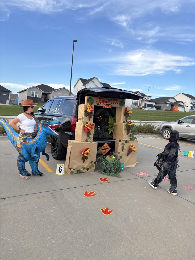 Adults with a trunk at the Harvest Hills Trunk or Treat Event.
