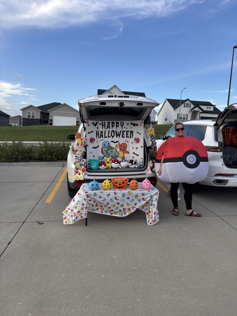 A teacher with a trunk at the Harvest Hills Trunk or Treat Event.