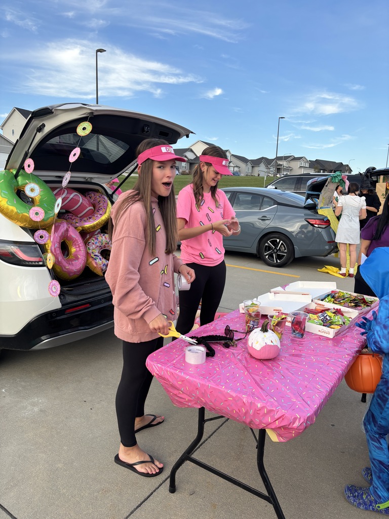 Adults with a trunk at the Harvest Hills Trunk or Treat Event.