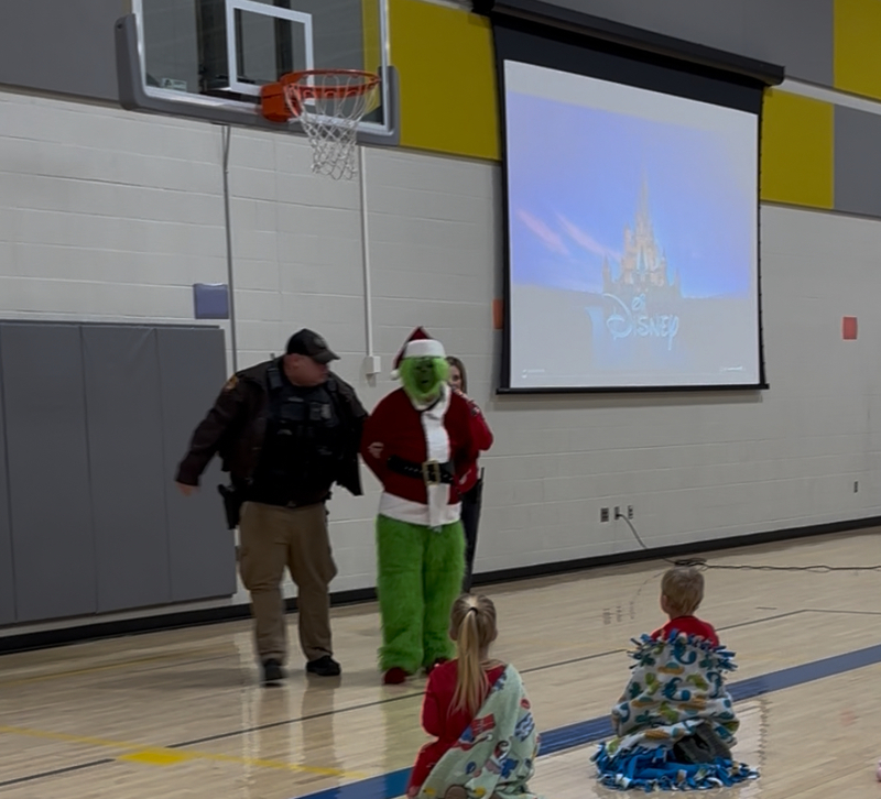 The Grinch getting caught by our SRO officer.