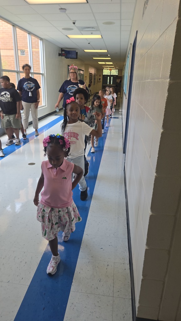 line of small children walking from lunch