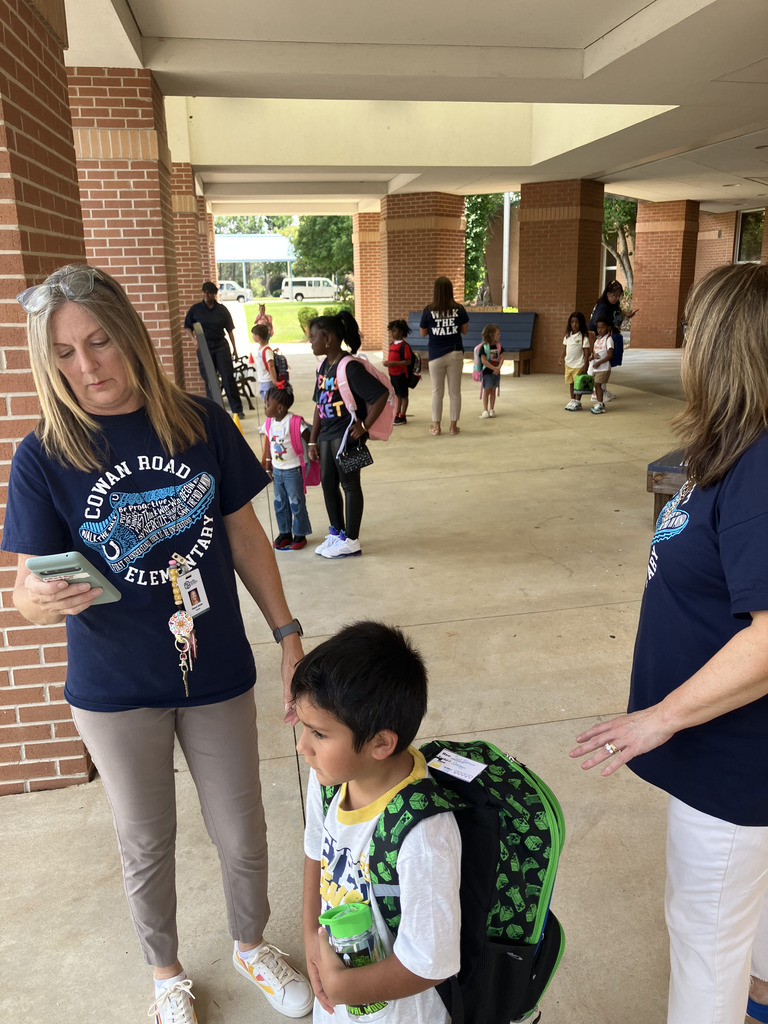front of school with students lining up for dismissal