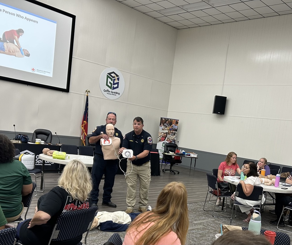 staff doing CPR on dummy