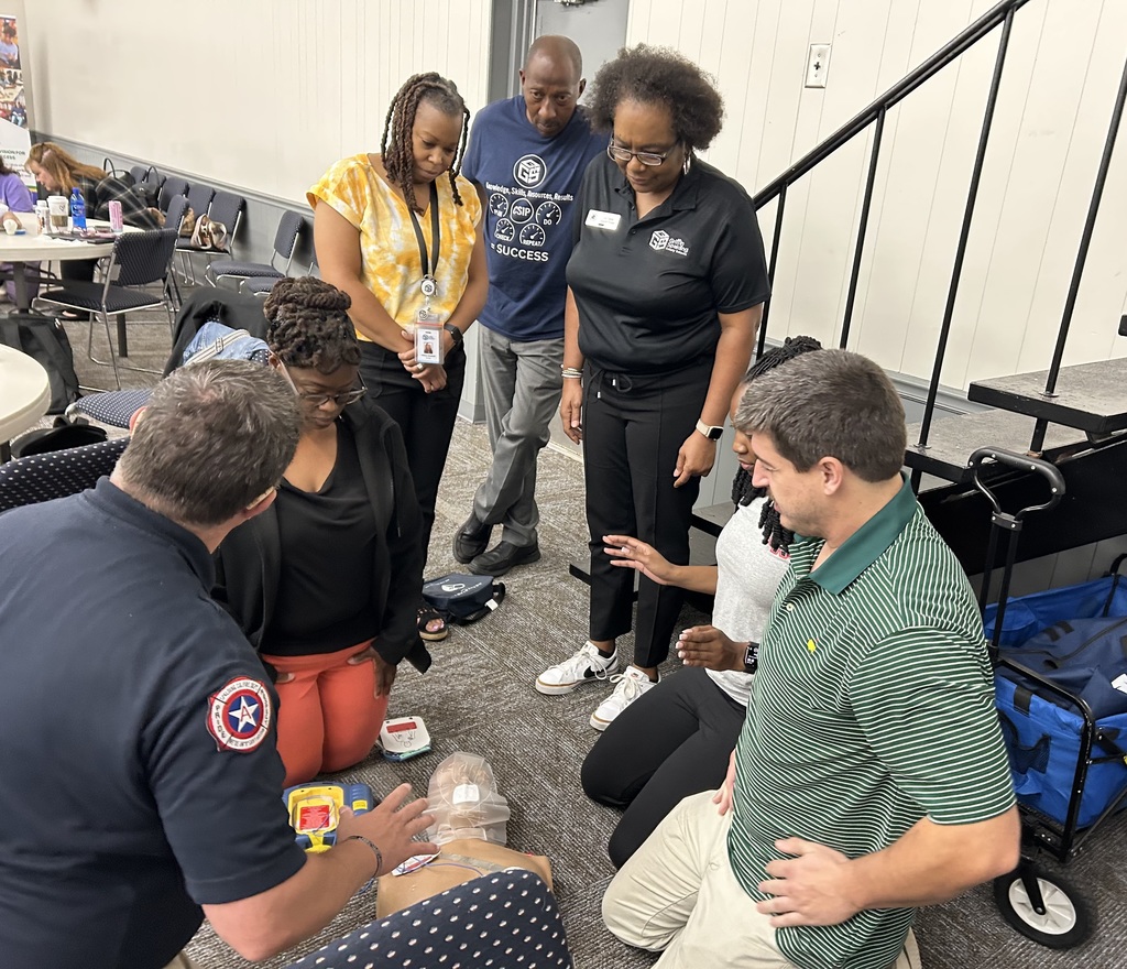 staff doing CPR on dummy
