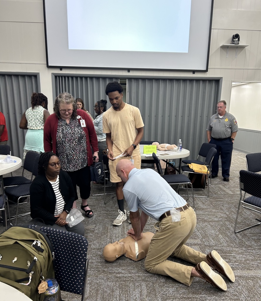 staff doing CPR on dummy