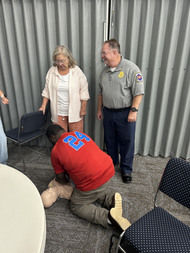 staff doing CPR on dummy