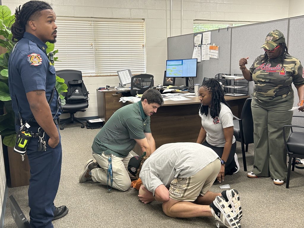 staff doing CPR on dummy