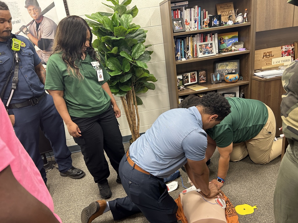 staff doing CPR on dummy