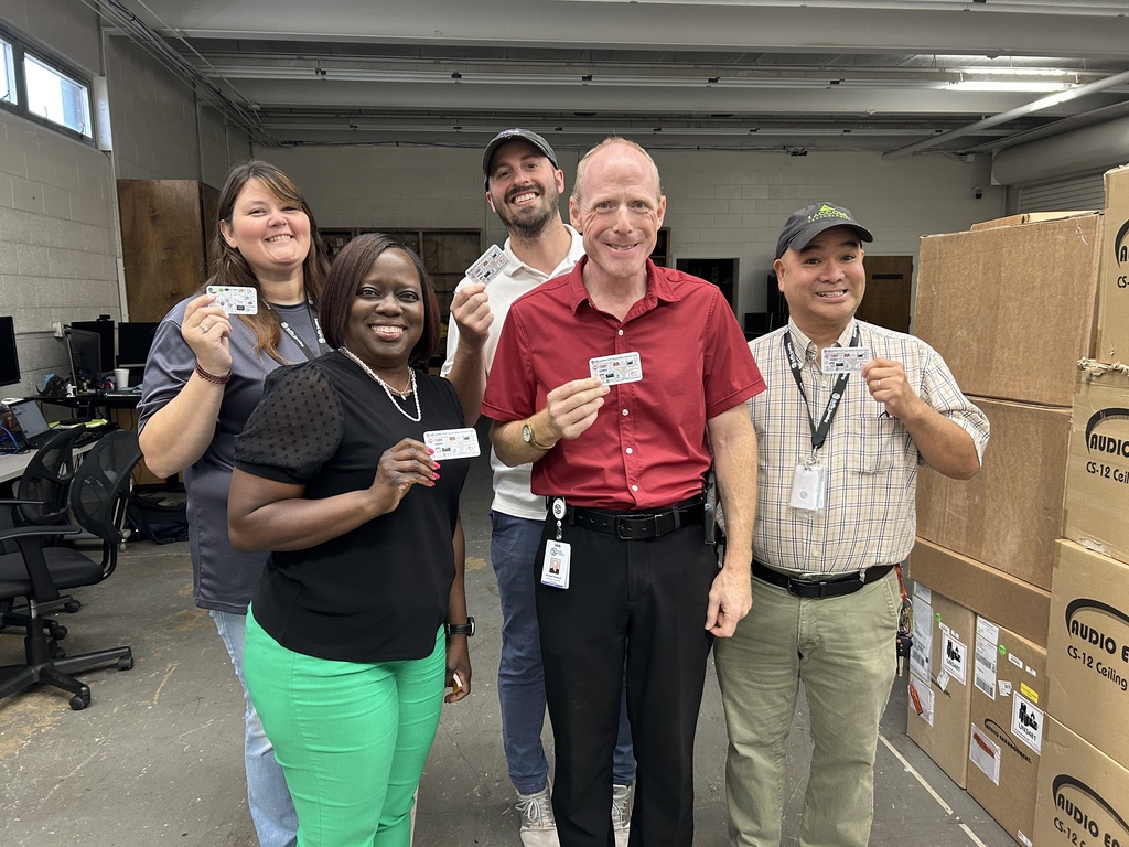 staff holding cards