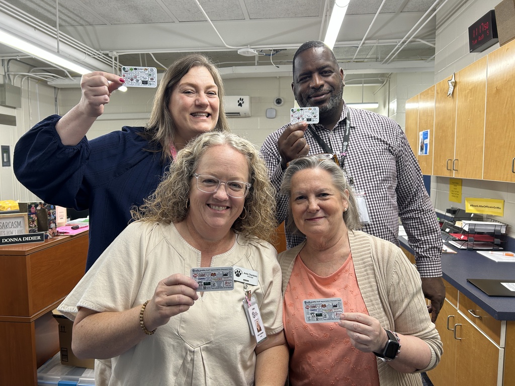 staff holding cards