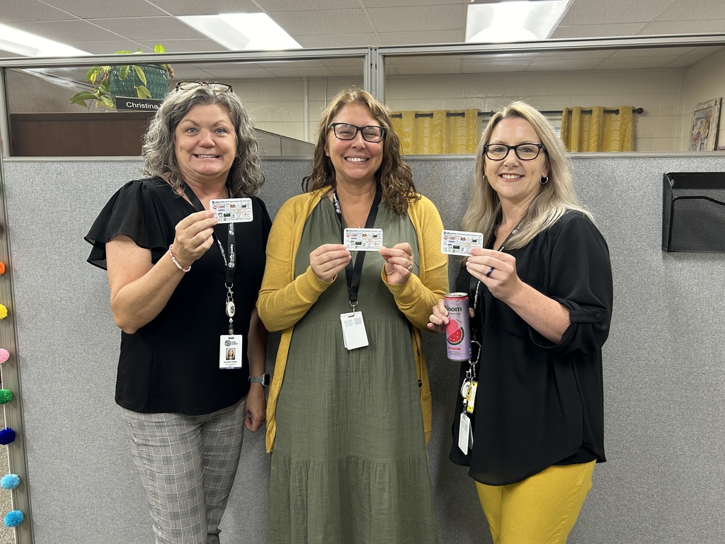 staff holding cards