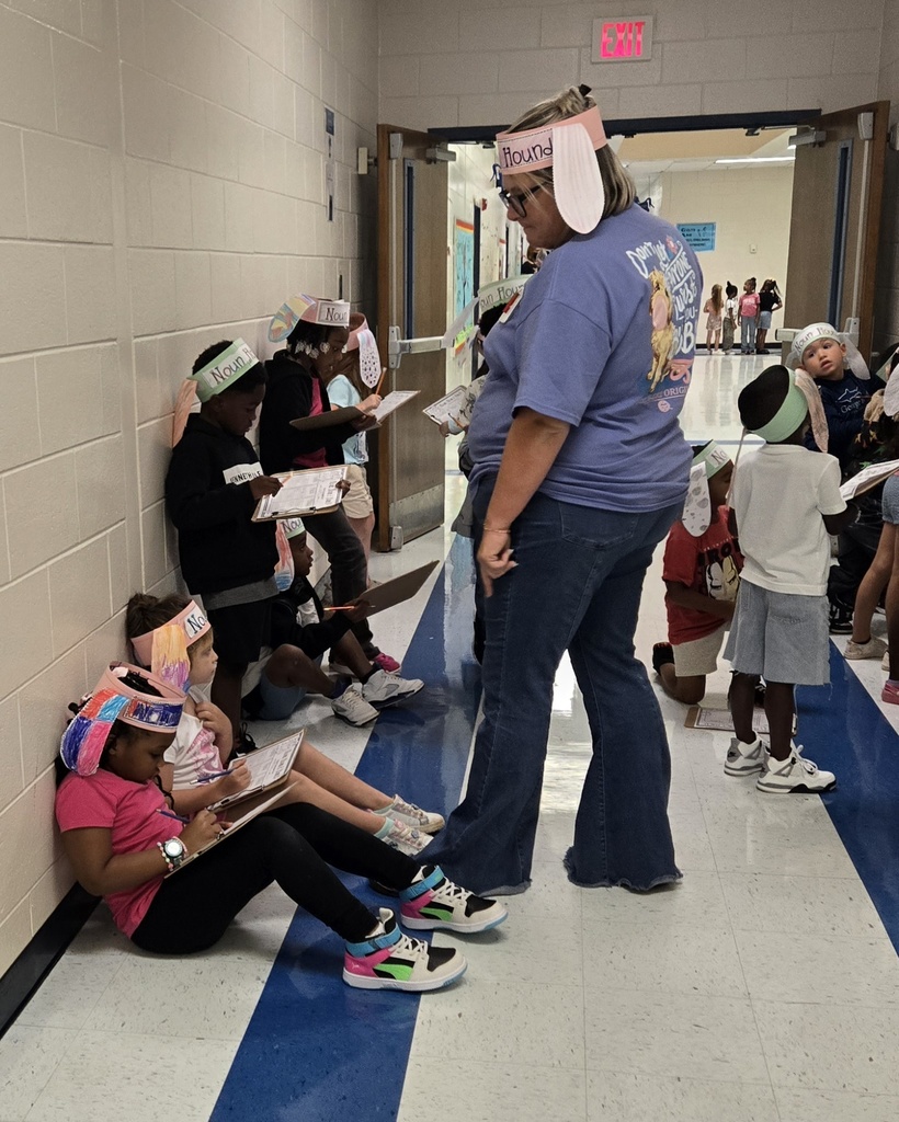 class in hall wearing "noun hound" ears