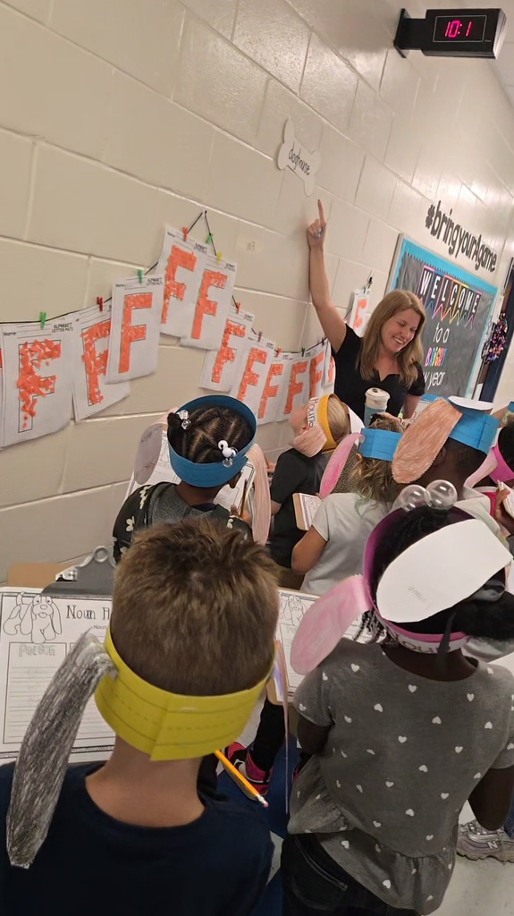 class in hall wearing "noun hound" ears