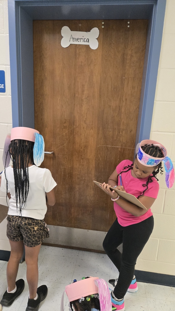 students holding clipboards