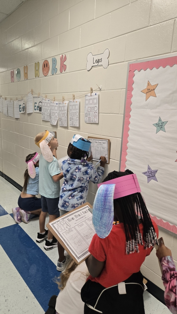 students holding clipboards