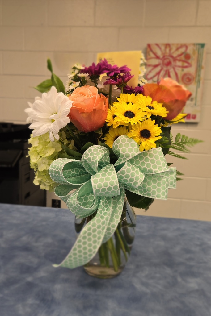 flowers in vase on office counter