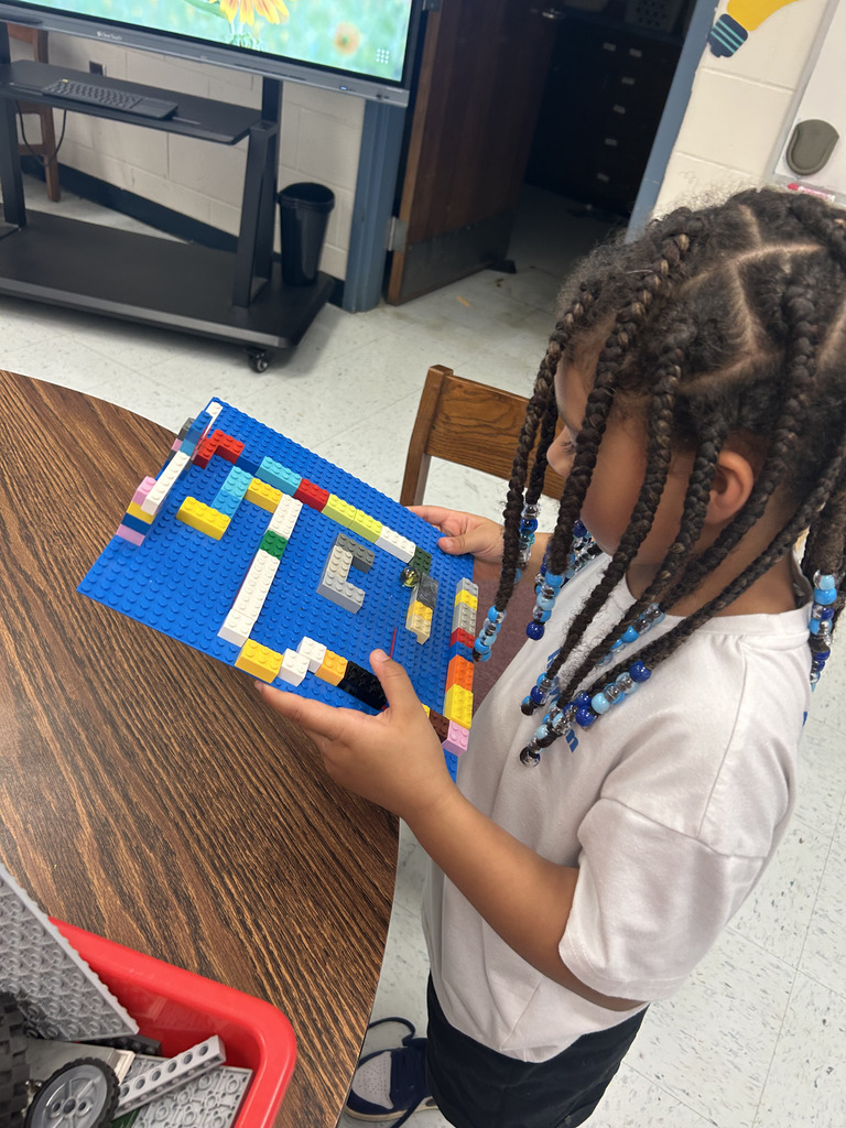 kids working with lego at tables, building mazes