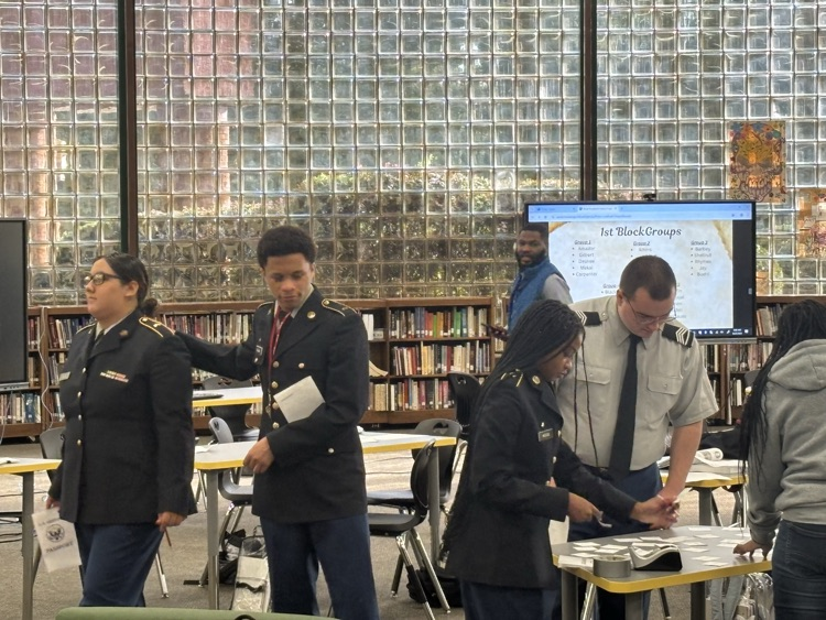 Mr Harris answers questions and offers advice as students complete activity