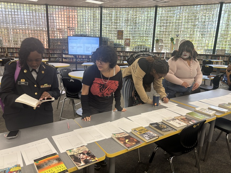 students look at various books and make selections