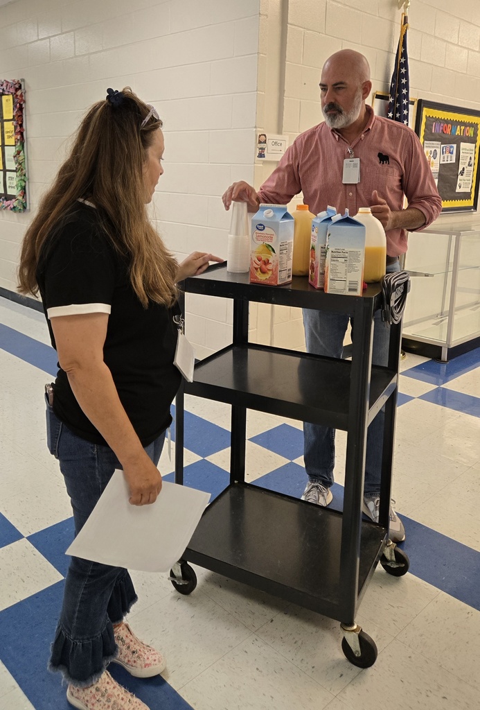 man pouring juice for