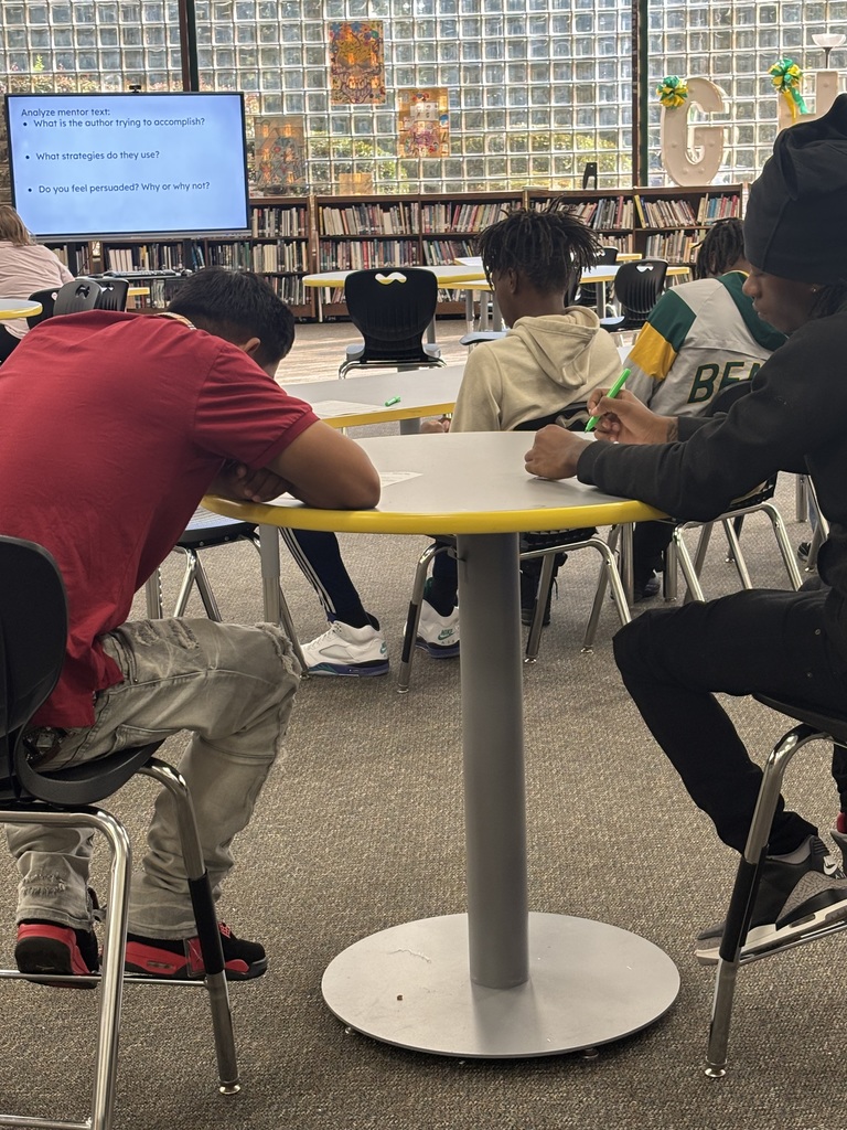 Students examine a mentor text for persuasive writing