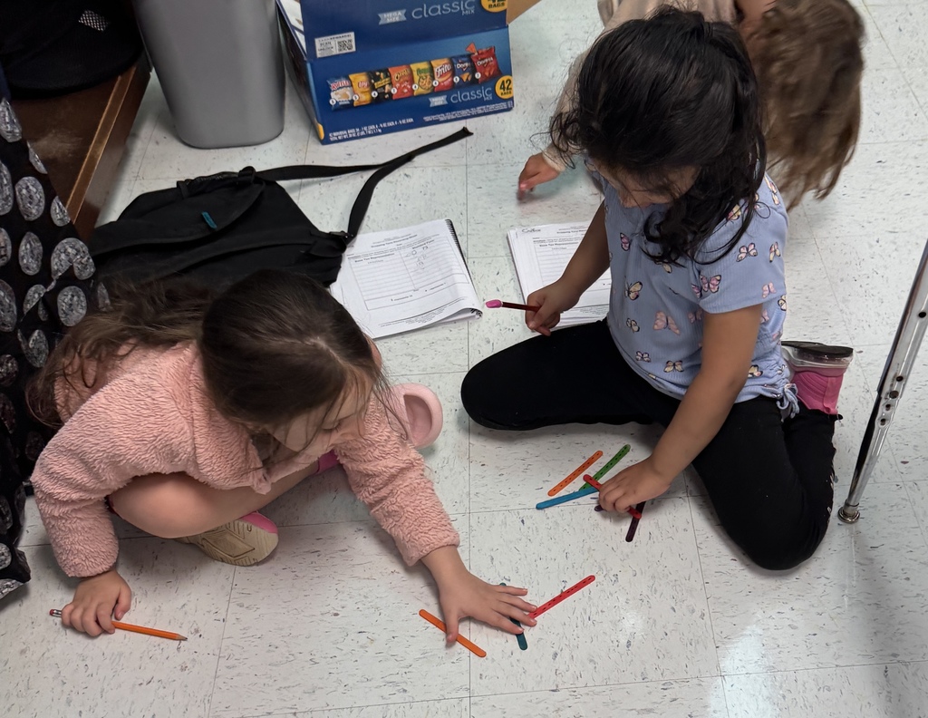 students on the floor using manipulatives to make compose and decompose numbers