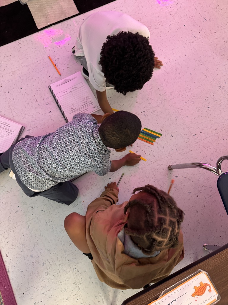 students on the floor using manipulatives to make compose and decompose numbers