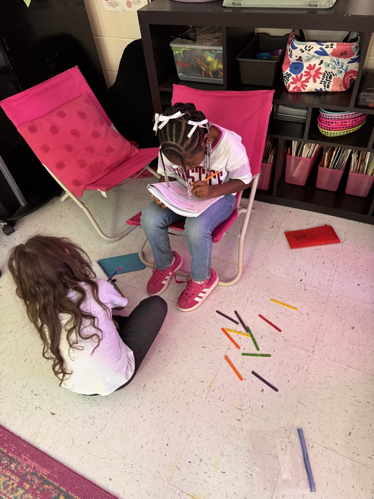 students on the floor using manipulatives to make compose and decompose numbers