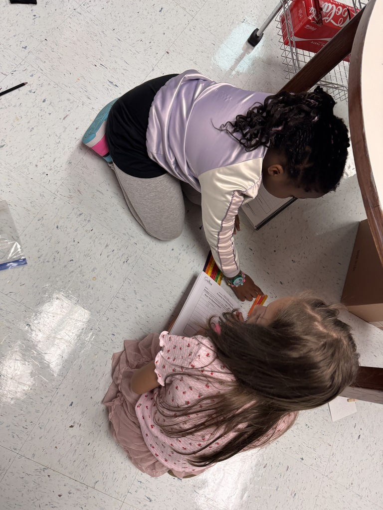 students on the floor using manipulatives to make compose and decompose numbers
