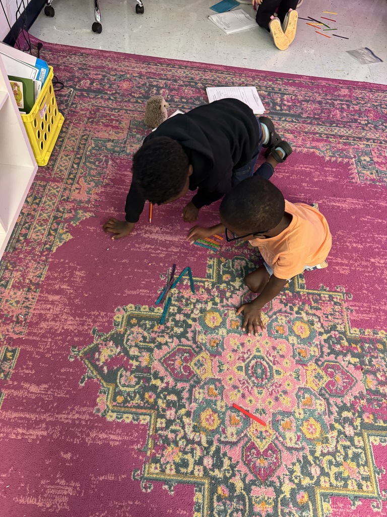 students on the floor using manipulatives to make compose and decompose numbers