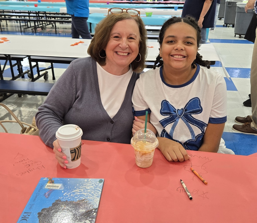 woman and girl at table