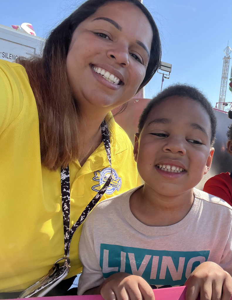 boy and woman on ride at fair