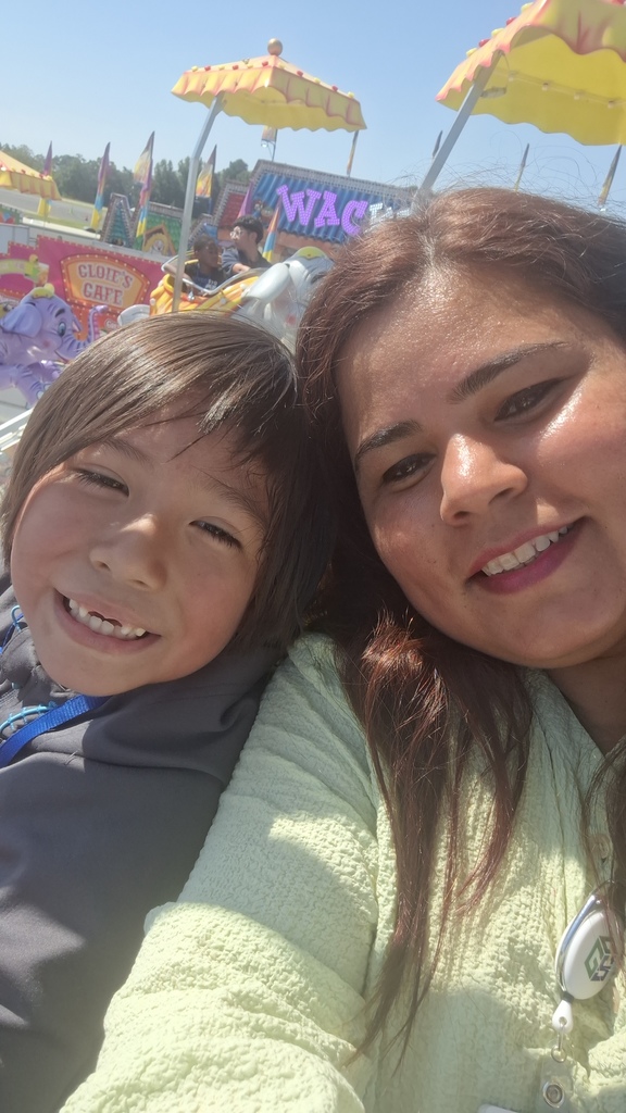 adult and child on ride at fair