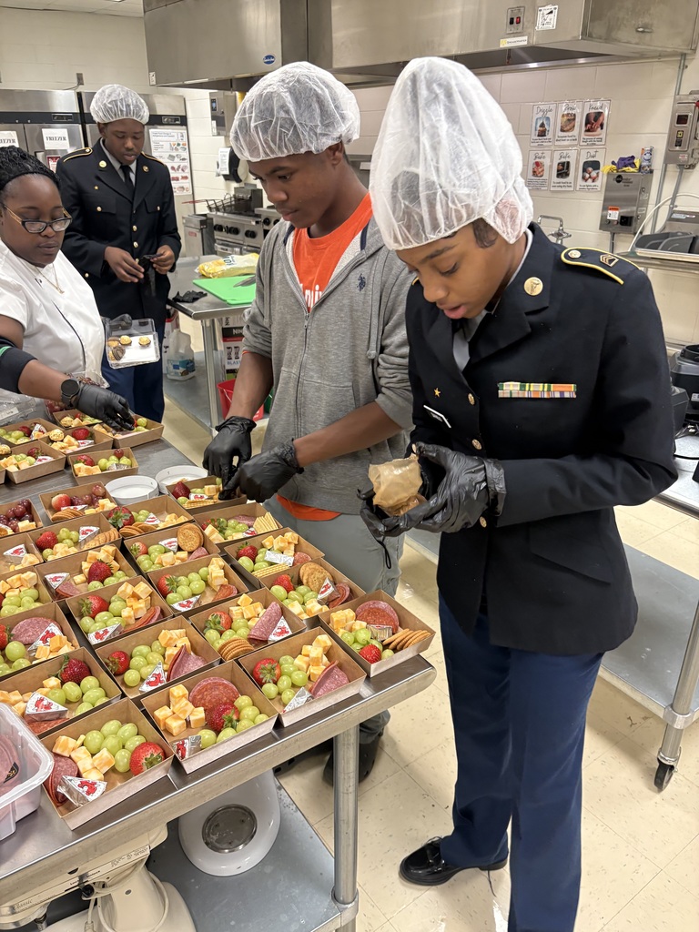 Under the direction of Ms. Barnes, students portion snacks into boxes