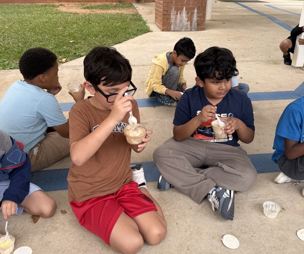 group of kids outside on sidewalk, eating coke floats