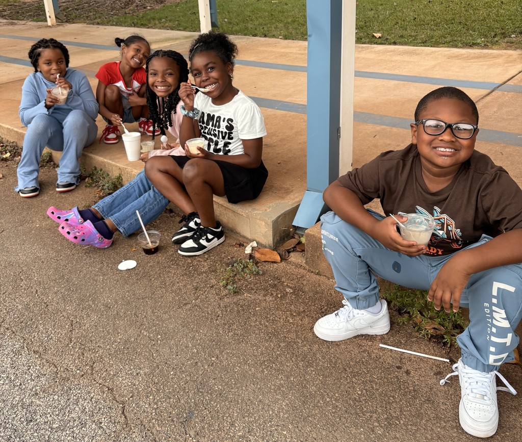 group of kids outside on sidewalk, eating coke floats