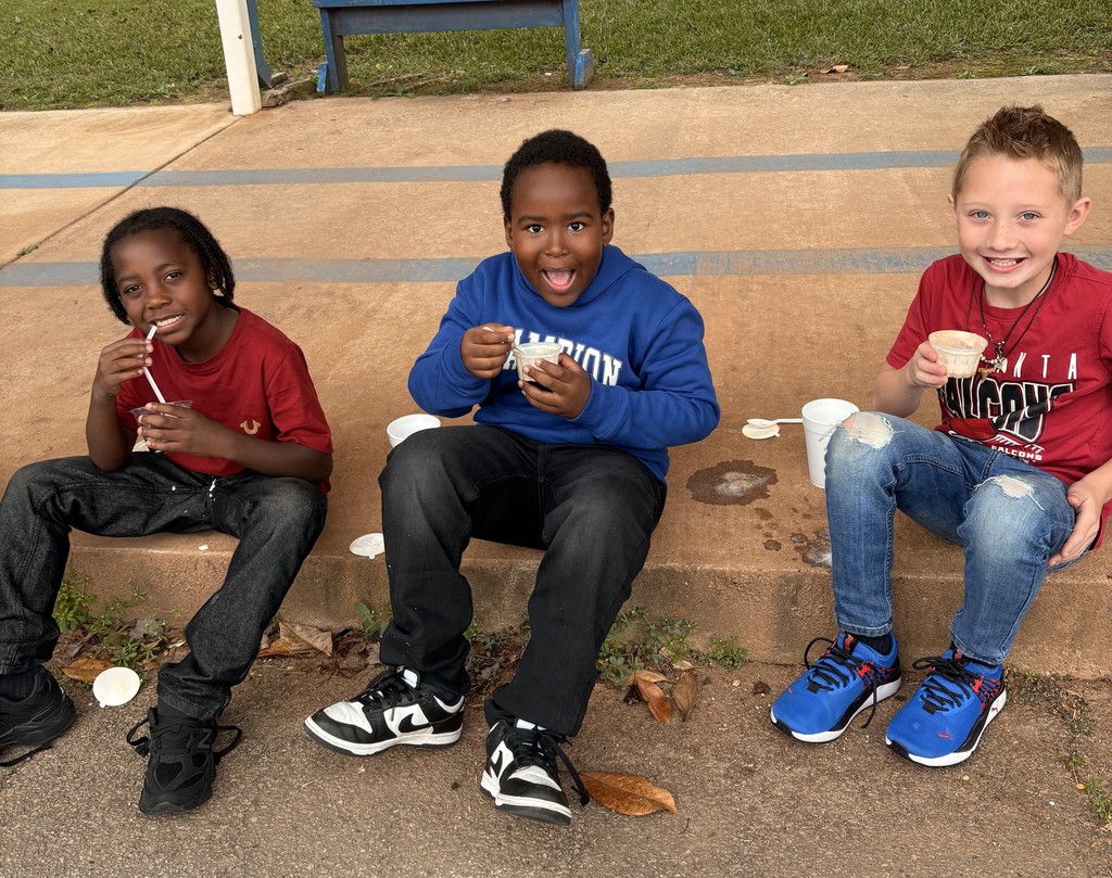 group of kids outside on sidewalk, eating coke floats