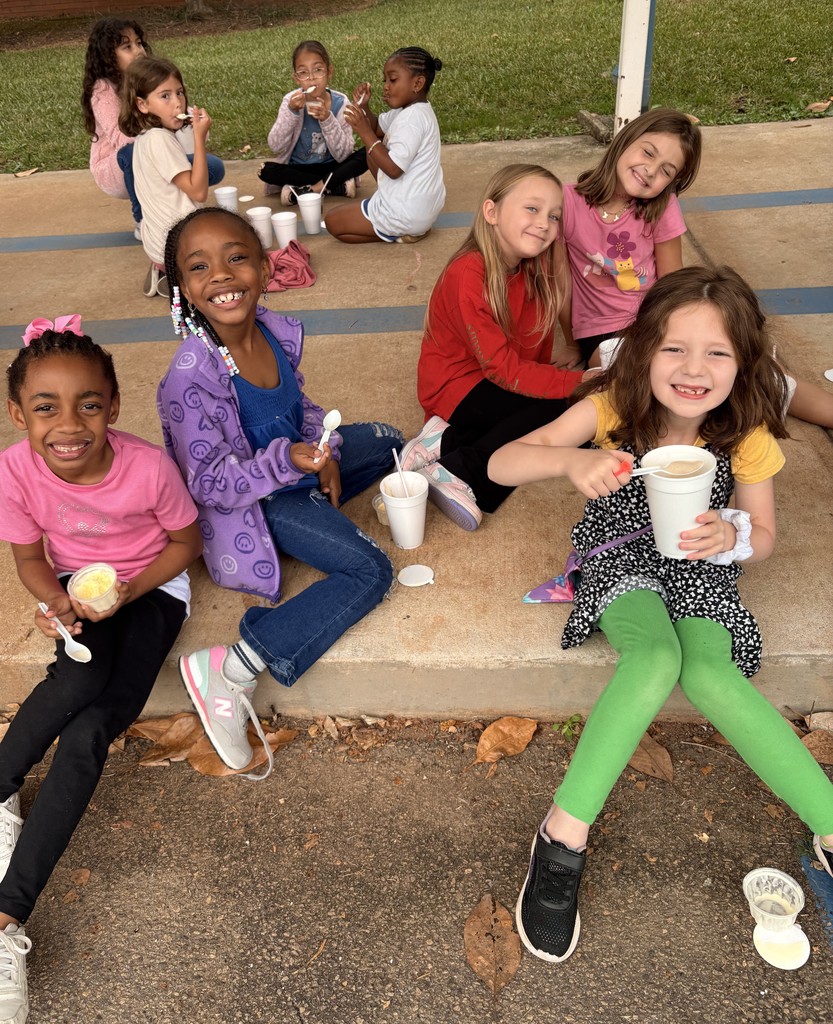 group of kids outside on sidewalk, eating coke floats